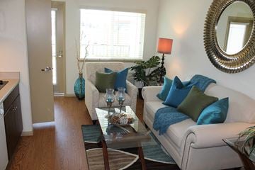 Morgan Hill apartment for rent - a living room with a white couch and a glass table