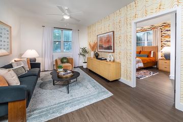 Kirkland apartment for rent - A living room with a blue rug and a wooden coffee table.