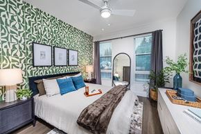 Kirkland apartment for rent - Bedroom with green accent wall at The Brynn in Kirkland WA