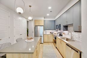 Houston apartment for rent - Model Sandalwood Design Package Kitchen at 1810 Main Apartments in Houston TX