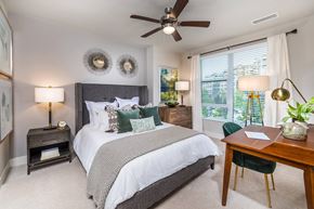 Kirkland apartment for rent - Bedroom with ceiling fan and window at Aspect at Totem Lake Apartments in Kirkland WA