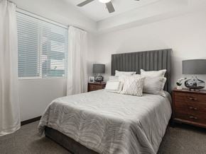 Tempe apartment for rent - Bedroom with ceiling fan and window at Norte Town Lake Apartments in Tempe Arizona