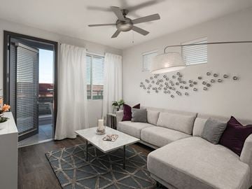 Tempe apartment for rent - a living room with a couch and a ceiling fan