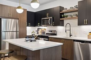 Peabody apartment for rent - a kitchen with stModel kitchen appliances at Jayden Apartments in Peabody MAainless steel appliances and black cabinets