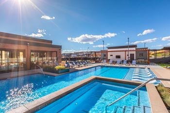 Resort-style pool and spa with cabanas