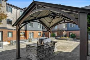 Auburn apartment for rent - Outdoor patio with grill at Auburn Court Apartments in Auburn WA
