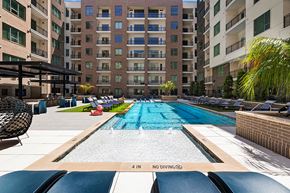 Houston apartment for rent - Pool Lounge Chairs at 1810 Main Apartments in Houston TX