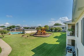 Austin apartment for rent - Pool and playground at Paradise Oaks apartments in Austin TX