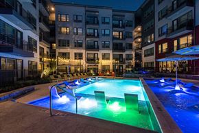 Plano apartment for rent - Night time pool view at Opal Legacy Central in Plano TX