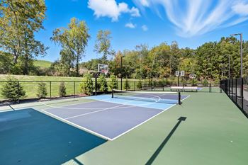 Versatile sport court with basketball and pickleball