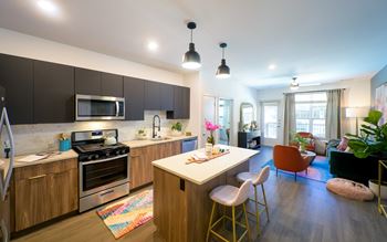 Kitchen island with breakfast bar and modern pendant lights*