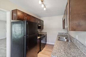 San Diego apartment for rent - Kitchen with black appliances at Park Crest Apartments in San Diego CA