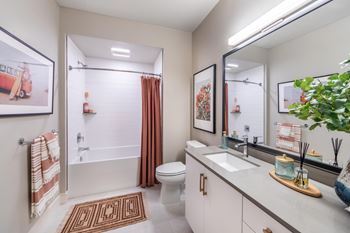 Oversized bathtub with ceramic tile surround
