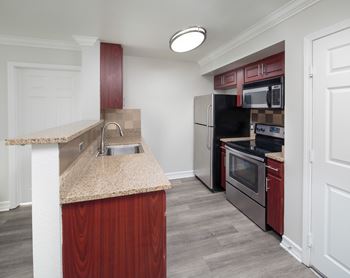 Wood-style flooring in living areas and kitchen*