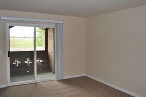 Dixon apartment for rent - Living room patio door at Bristol Apartment Homes in Dixon CA
