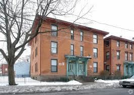 Hartford apartment for rent - a red brick house with a tree in front of it