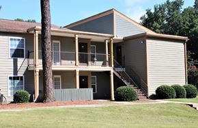 Clarkston apartment for rent - A two-story house with a balcony on the second floor at Clarkston Station Apartments, Clarkston, GA
