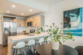 Fort Lee apartment for rent - A modern kitchen with a dining table and chairs.