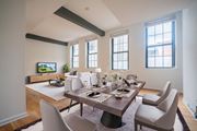 Hoboken apartment for rent - A modern dining room with a wooden table and chairs.