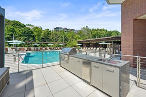 Edgewater apartment for rent - A pool area with a diving board and a metal railing.
