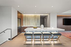 Edgewater apartment for rent - A modern dining room with a long table and chairs.
