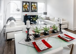 New Haven apartment for rent - A modern dining room with a glass table and white chairs.
