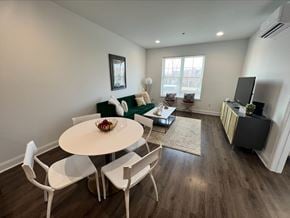 Milford apartment for rent - A dining room with a white table and chairs.