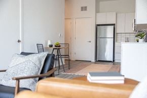 Detroit apartment for rent - a kitchen with a refrigerator freezer next to a stove top oven