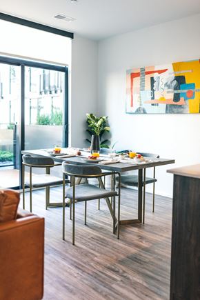 Detroit apartment for rent - A modern dining room with a table set for four.