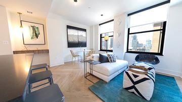 Detroit apartment for rent - a living room with a couch and a table