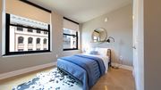 Detroit apartment for rent - Elegant bedroom with city views at The Stott, Detroit, MI, 48226.