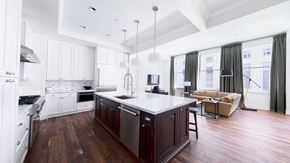 Detroit apartment for rent - Kitchen with island and stainless steel appliances at Vinton, Detroit, Michigan.