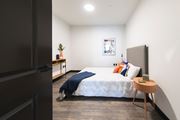 Cleveland apartment for rent - Spacious bedroom with wall art and modern styling at The May.