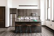 Cleveland apartment for rent - Gourmet kitchen with island, modern appliances, and elegant backsplash at The May.