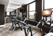 Detroit apartment for rent - The Stott fitness center with treadmills and elliptical machines.