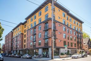 Portland apartment for rent - A multi-story building with a mix of orange and red facades.