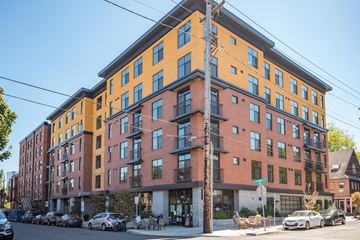 Portland apartment for rent - A multi-story building with a mix of orange and red facades.