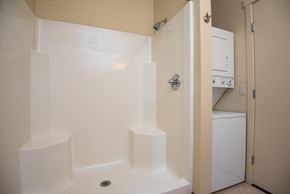 Portland apartment for rent - a bathroom with a shower and a washing machine in it