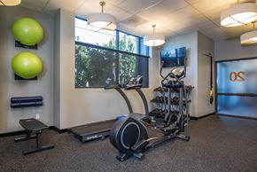 Portland apartment for rent - a gym with exercise equipment and a window