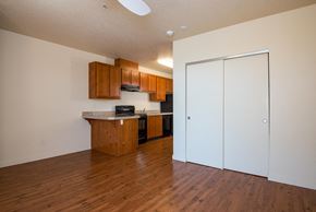 Portland apartment for rent - a kitchen and living room with wood flooring and