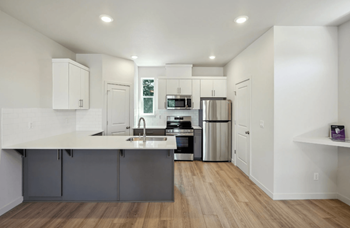 Modern kitchen with island and white countertops