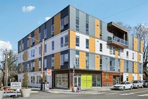 Portland apartment for rent - A street view of a multi-story building with a