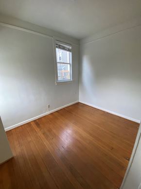 Portland apartment for rent - an empty room with wood floors and a window