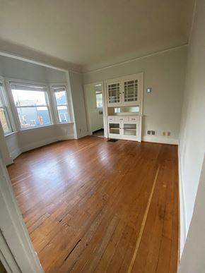 Portland apartment for rent - an empty living room with a hardwood floor