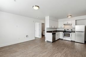 Portland apartment for rent - A kitchen with white appliances and wood floors.