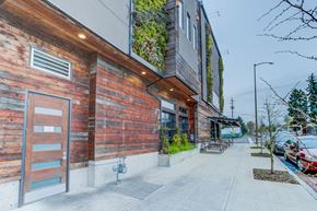 Portland apartment for rent - the side of a building with a sidewalk and a parking meter