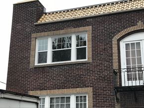 Portland apartment for rent - A brick building with a window and a balcony.