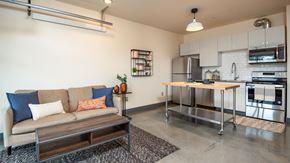 Portland apartment for rent - A kitchen with a refrigerator, oven, and microwave.