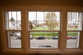 Portland apartment for rent - A view from a window looking out at a parking lot.