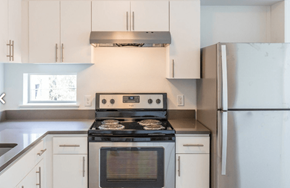 Portland apartment for rent - A modern kitchen with a stove, oven, and refrigerator.